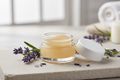 pertroleum based lavender lipbalm in a clear glass 5 ml container with a white lid