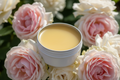 small white metal tin with a yellow wax finish italian rose background